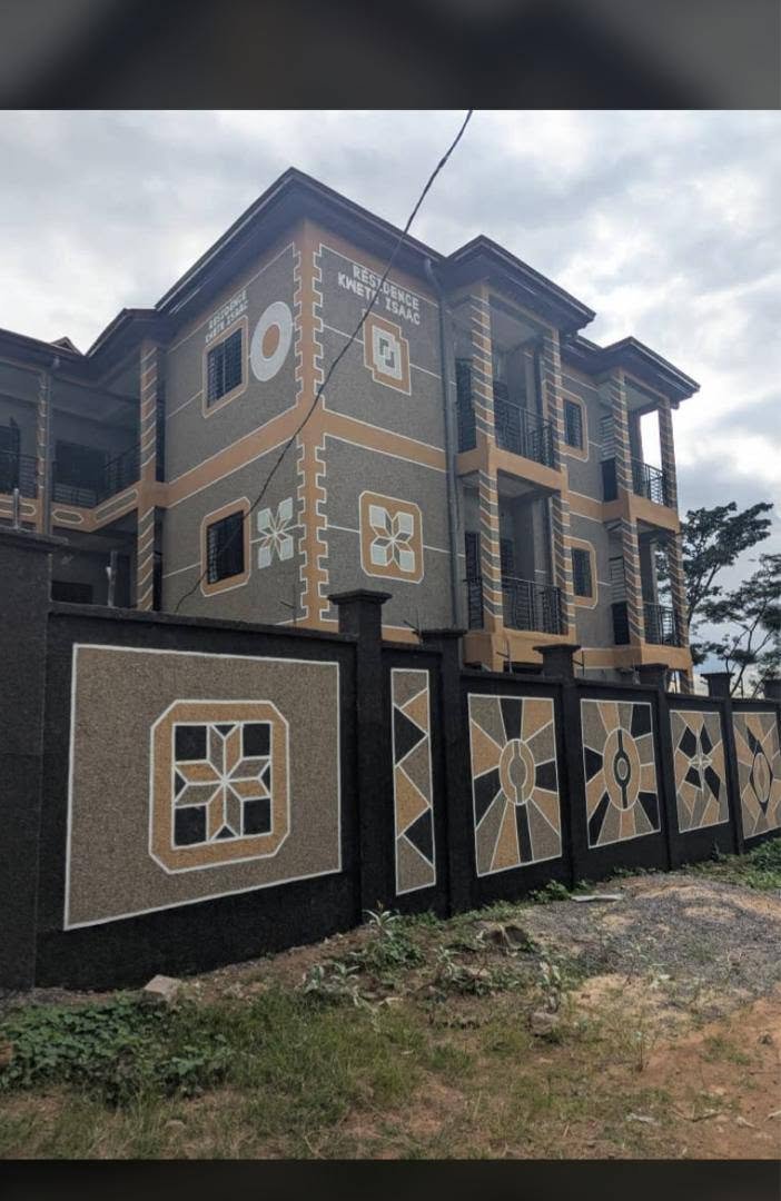 Commercial building with black gold sparkle granite finish boosting property value in Cameroon